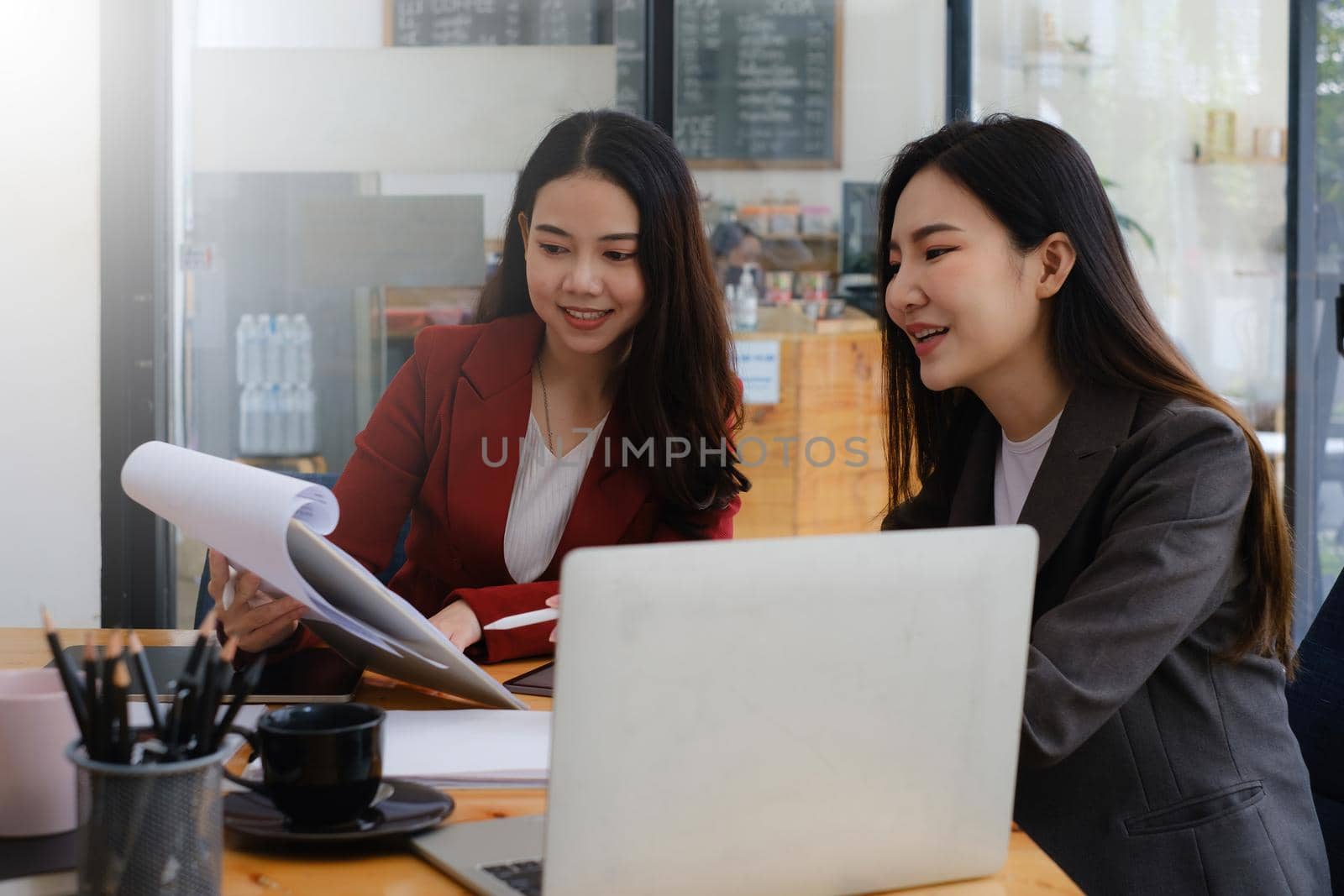 Business team working together and training to analyze technical price graph and indicator. Chart and stock trading computer screen. by itchaznong