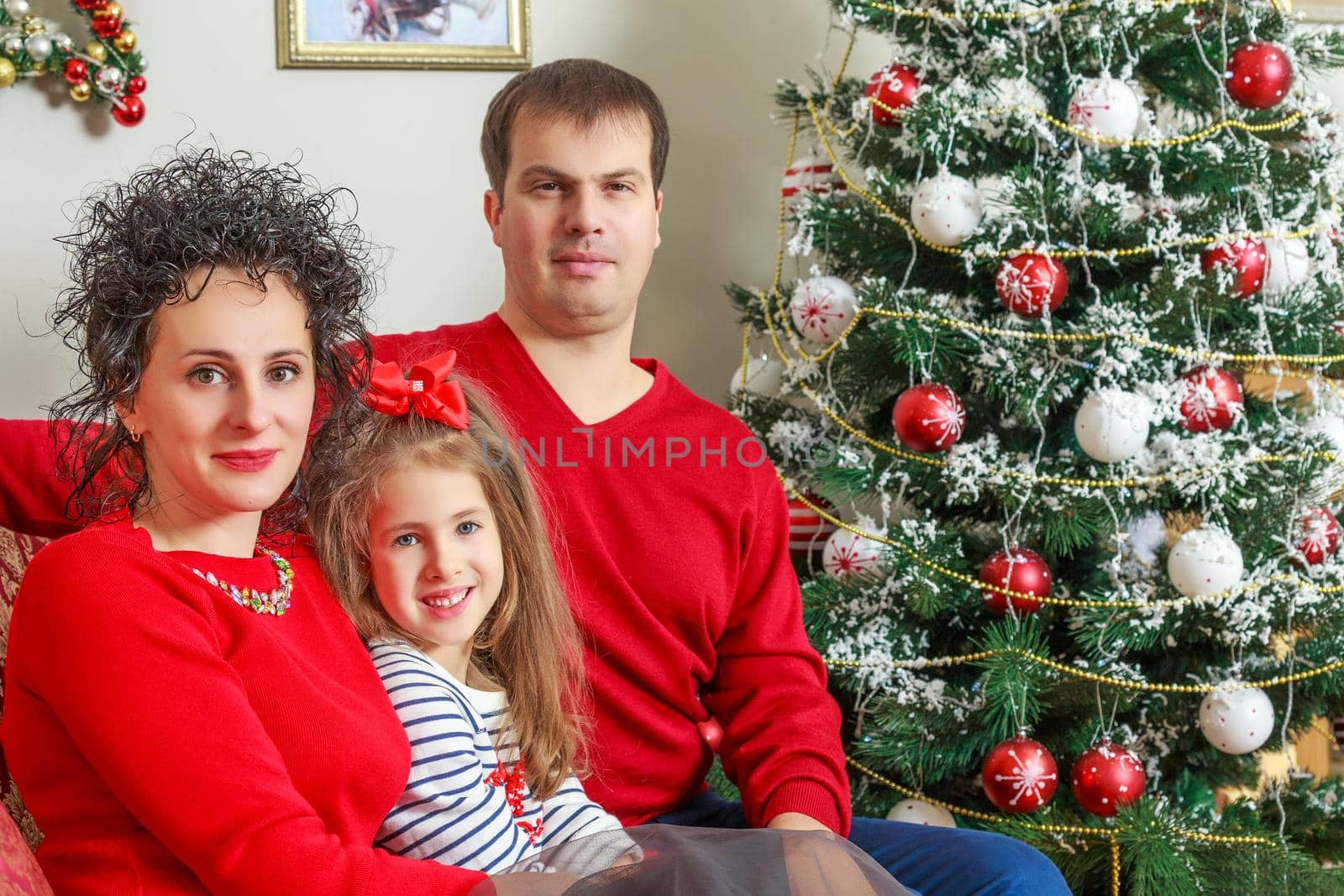 The young family celebrates New year. by kolesnikov_studio