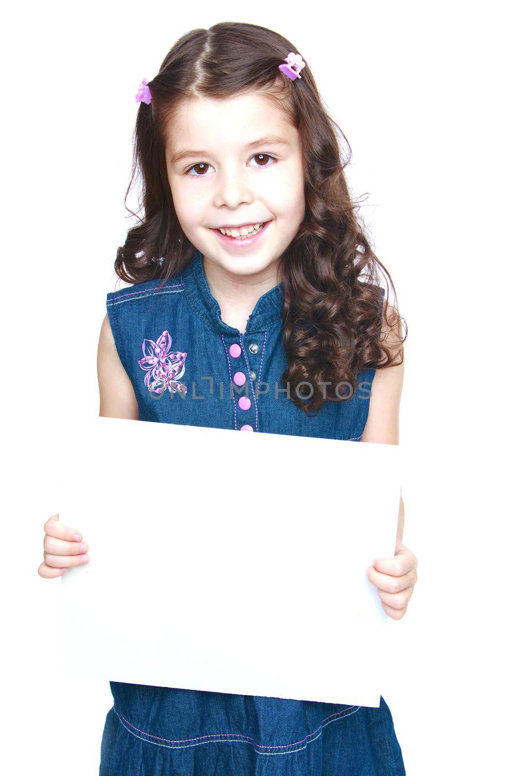 Girl in jeans dress holding a banner in front.Isolated on white background portrait.