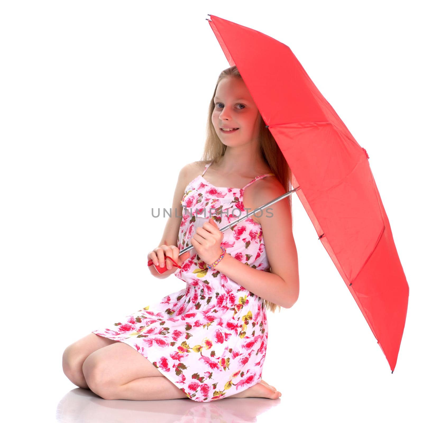 Beautiful teenage girl, in a summer dress under an umbrella. The concept of a happy childhood, summer outdoor recreation. Isolated on white background.