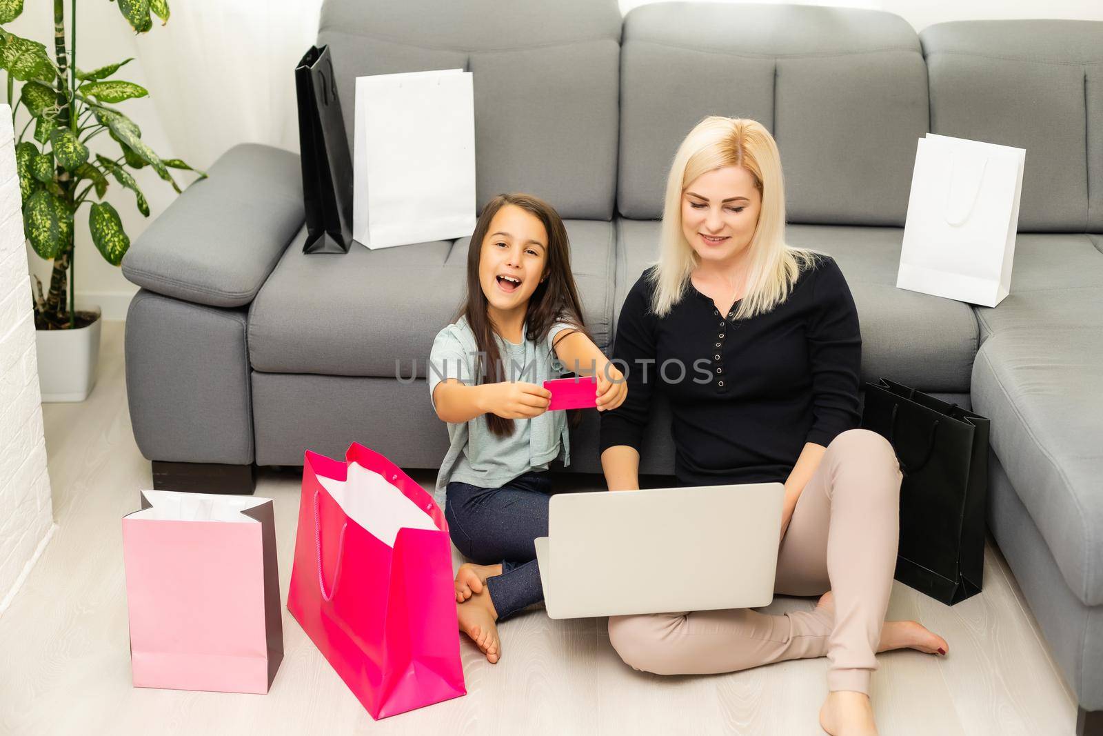 picture of happy mother and child with laptop computer, shopping online
