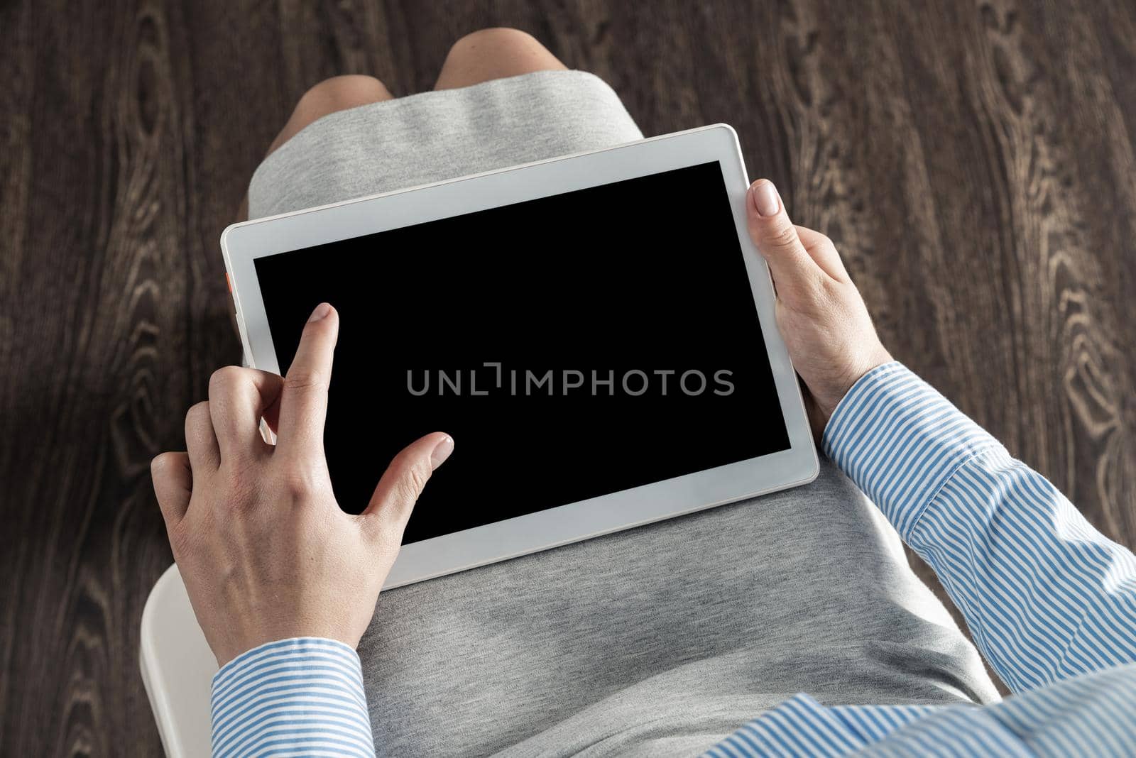 close-up of female hands with a computer tablet