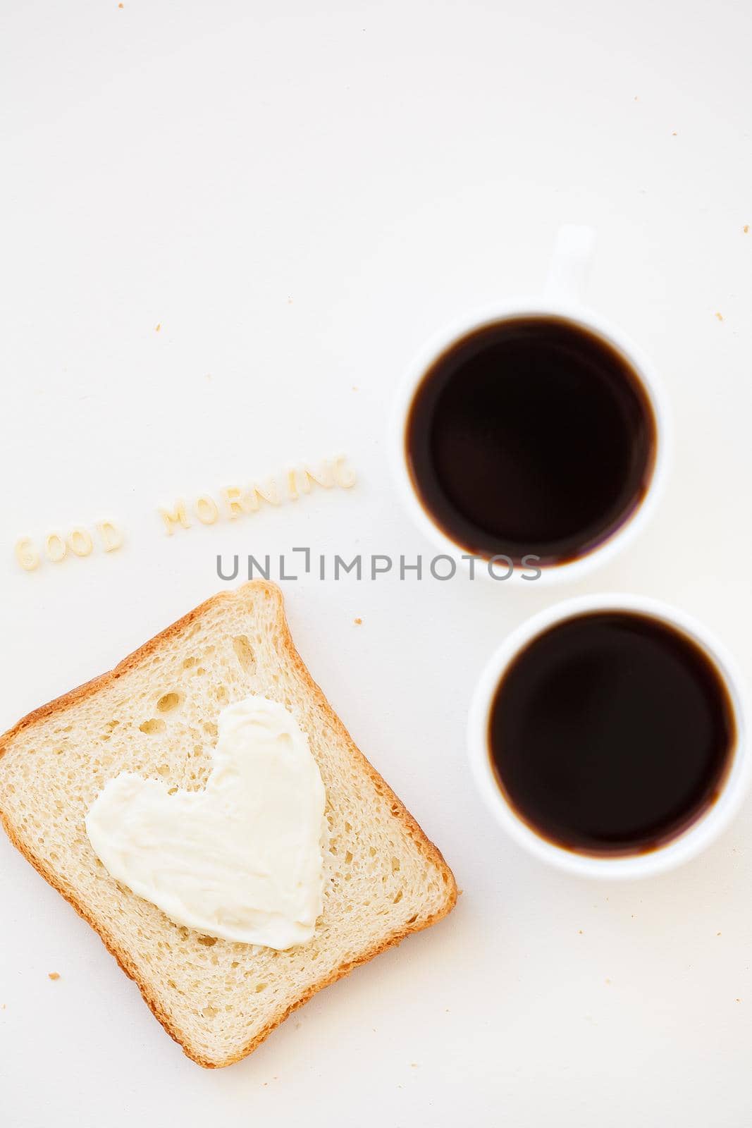 sandwich for breakfast in the form of heart with cheese - good morning sign and two coffee cups