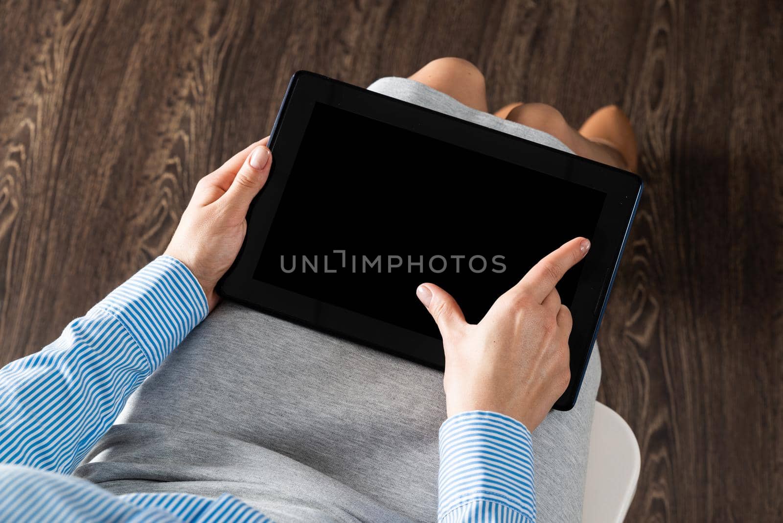 close-up of female hands with a computer tablet