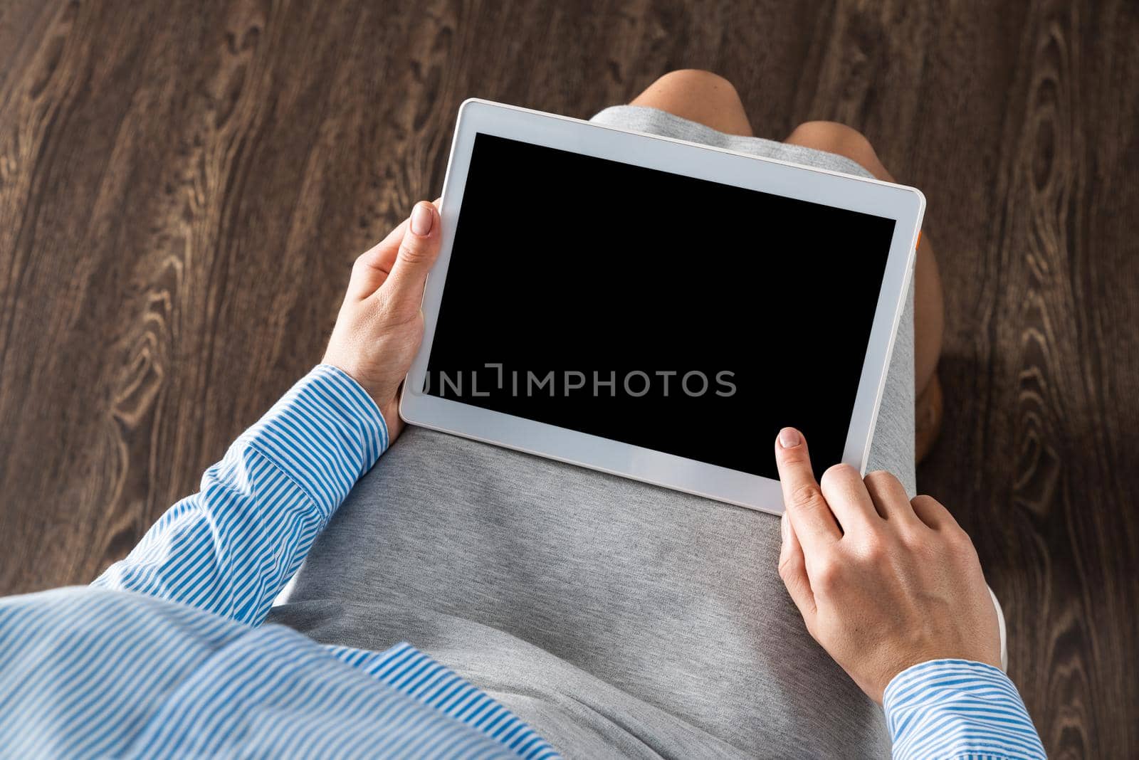 close-up of female hands with a computer tablet