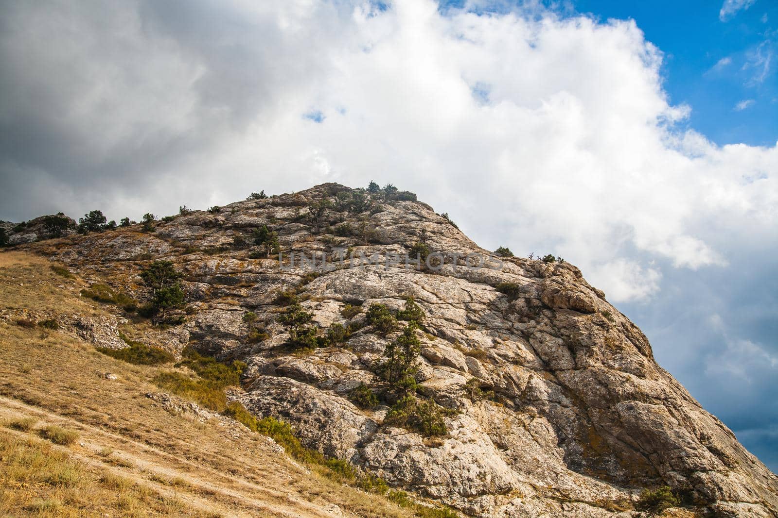 Mountain in a summer sunny day and clouds.