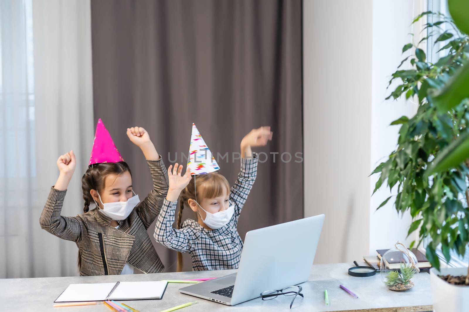 Happy family with two sibling celebrating birthday via internet in quarantine time, self-isolation and family values, online birthday party