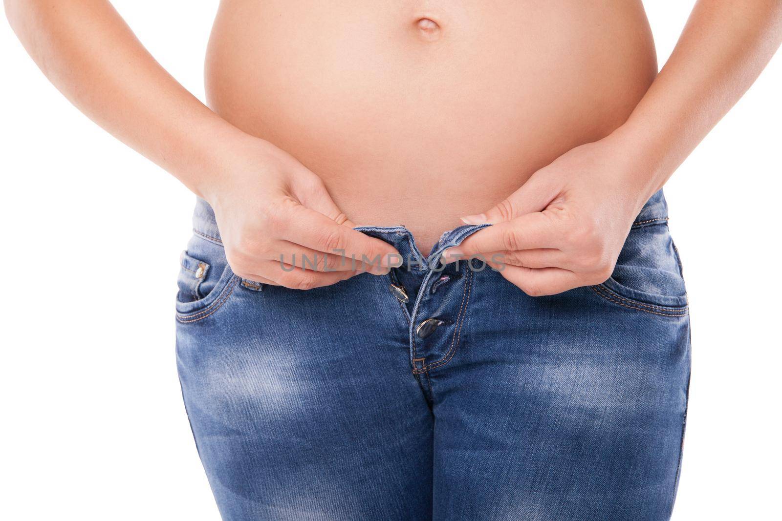 Pregnant belly woman wearing jeans and white shirt