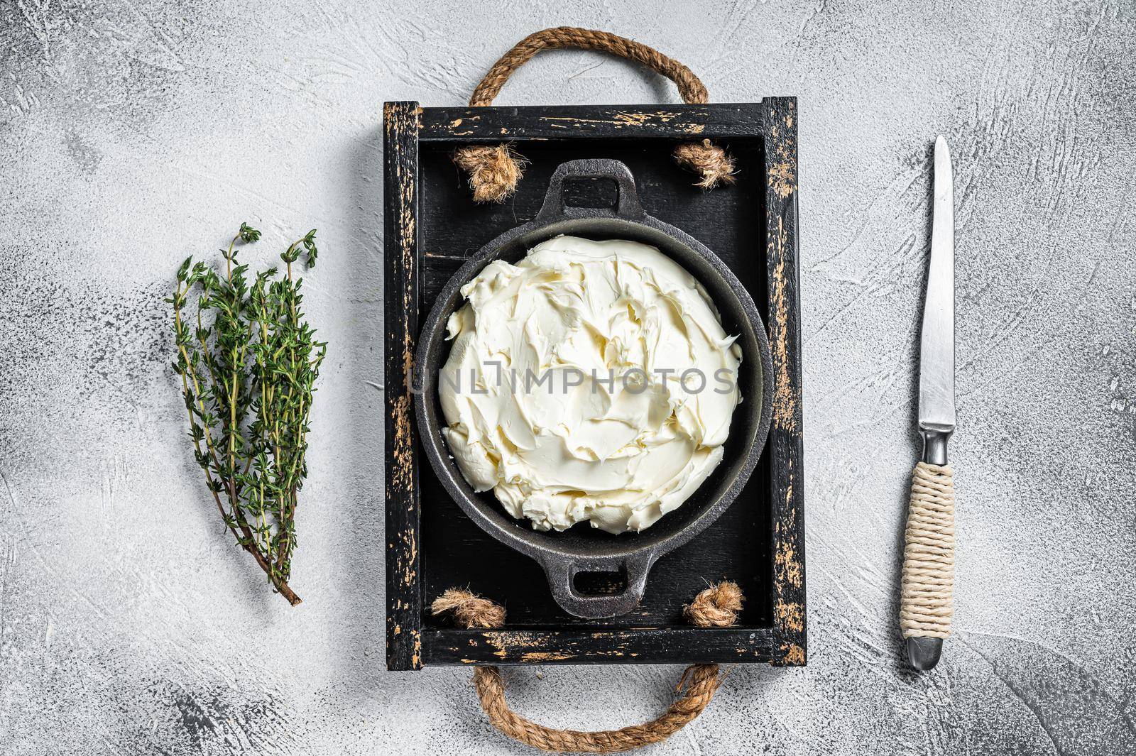 Cream cheese Mascarpone in a wooden tray for tiramisu. White background. Top view by Composter