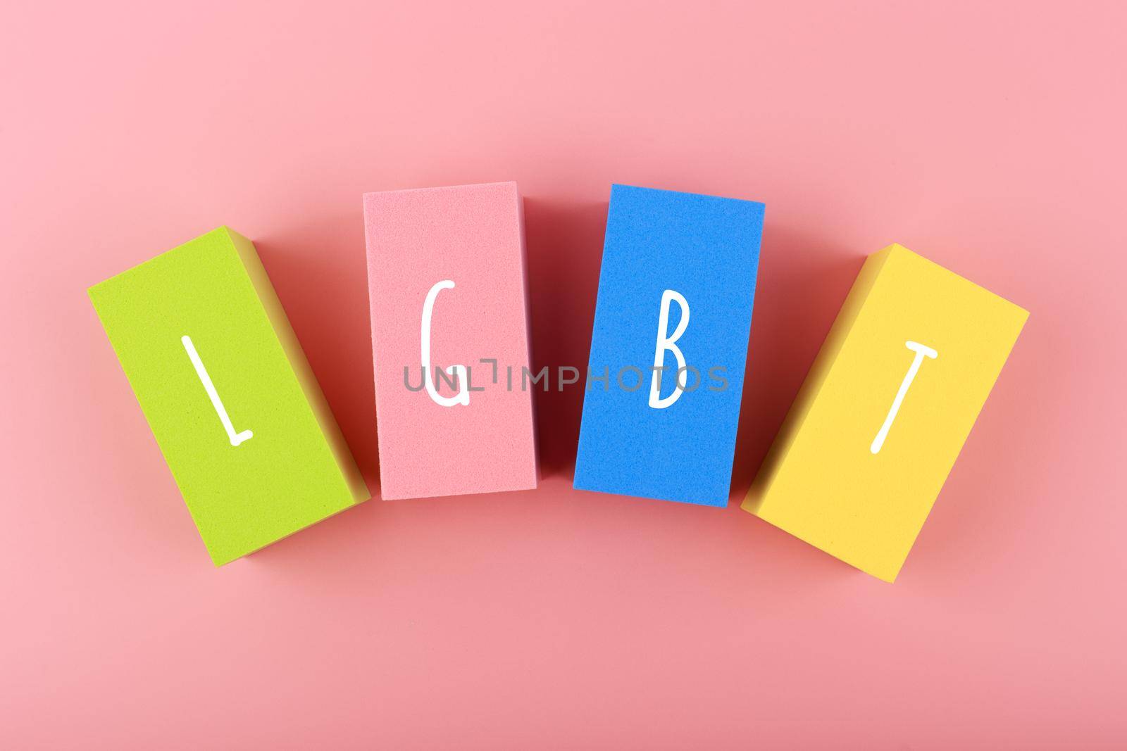 Lgbt letters on multicolored rectangular geometric figures on pink background. by Senorina_Irina