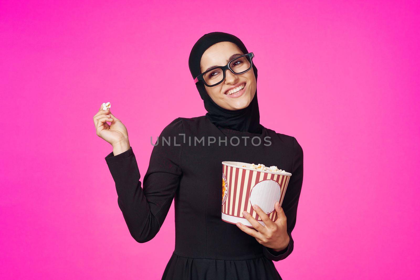 pretty woman attractive look popcorn glasses movie watching model ethnicity. High quality photo