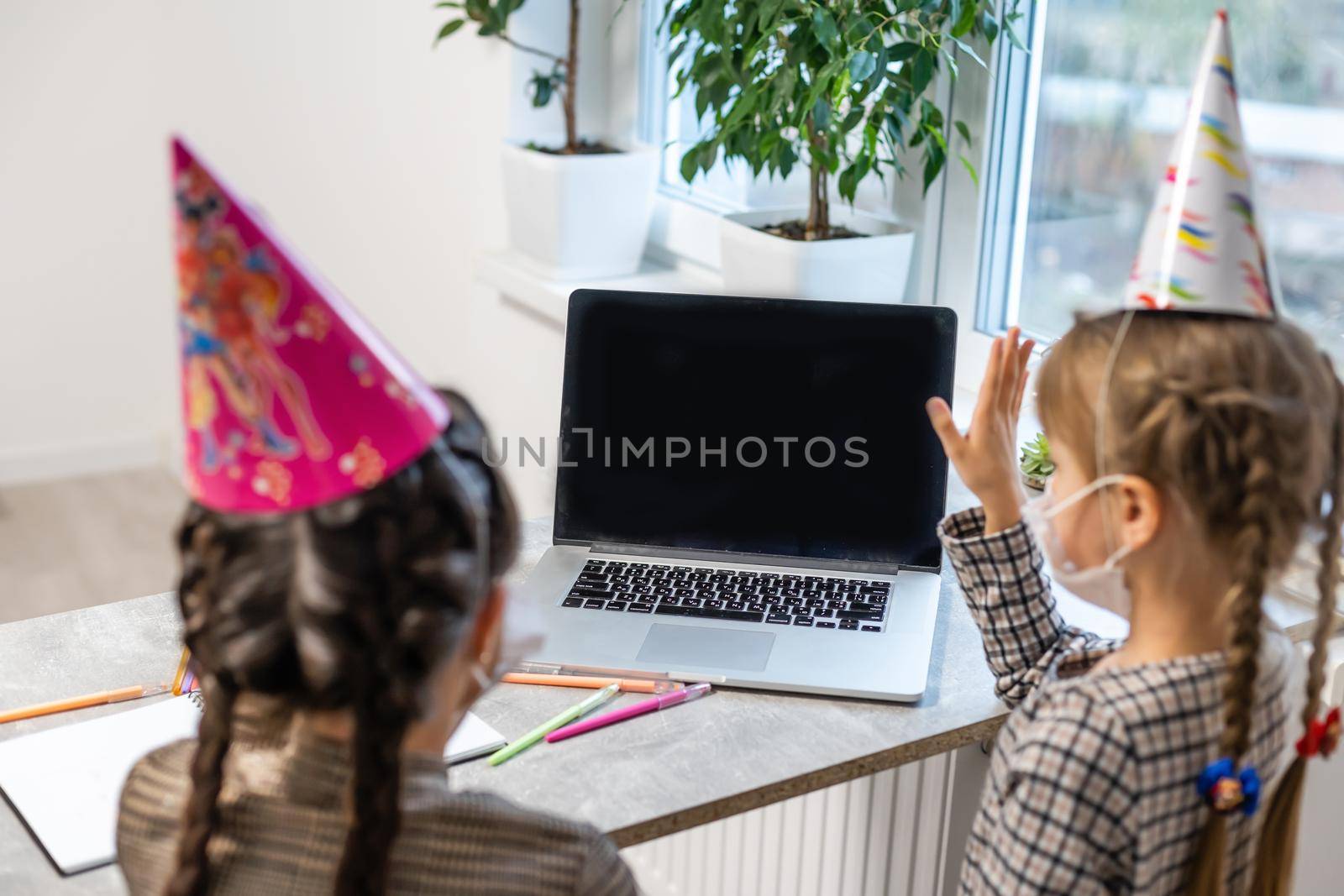 Happy family with two sibling celebrating birthday via internet in quarantine time, self-isolation and family values, online birthday party