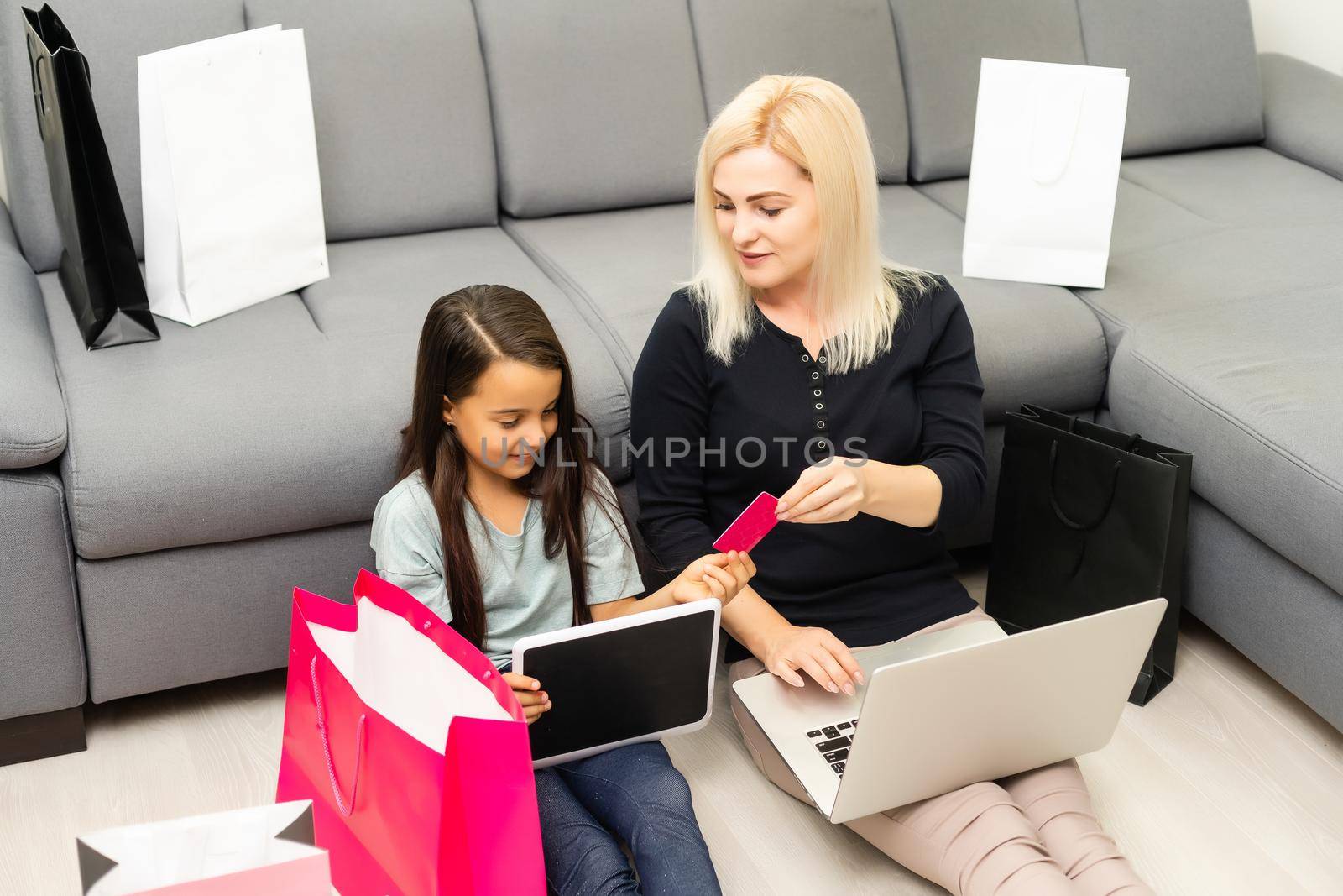 Mother and daughter shopping on internet by Andelov13