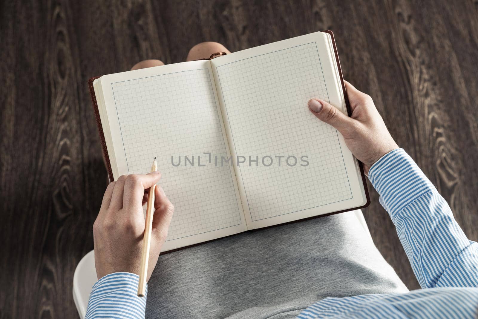 close-up a female hands with notebook and pencil