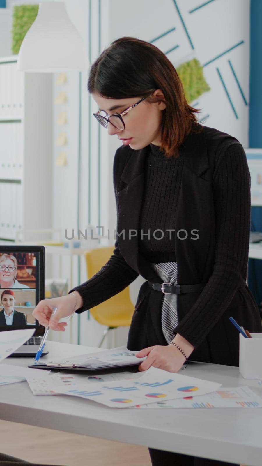 Women talking to workmates on video call for briefing meeting by DCStudio