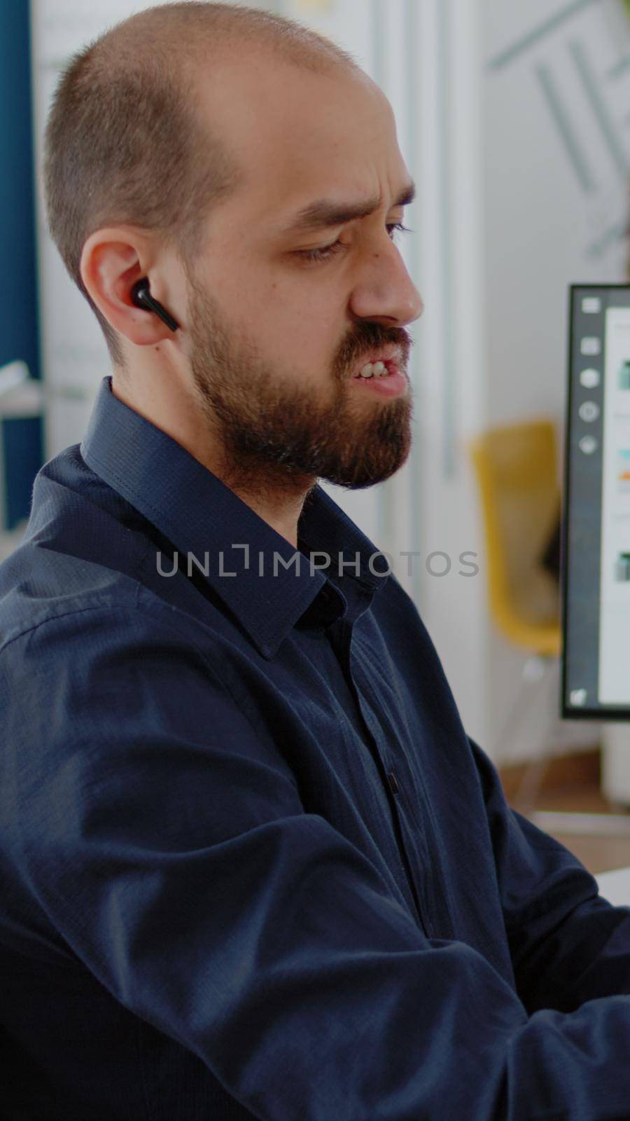 Person talking to colleagues on video call communication, using smartphone for business meeting. Businessman holding mobile phone for online conference with workmates in corporate office