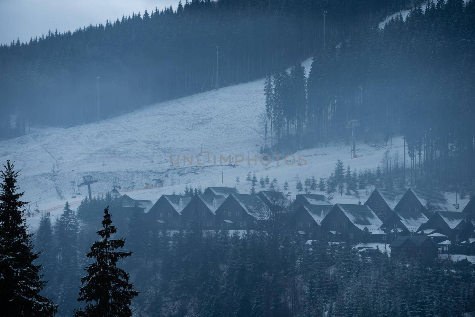 family with snowboards at winter resort by Andelov13