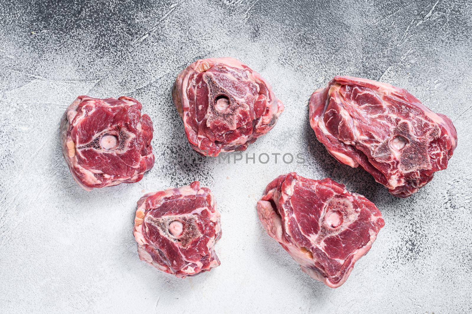 Raw lamb neck meat on cooking table..White background. Top view by Composter