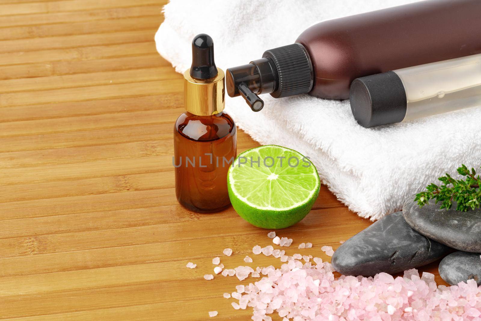 Beauty treatment items for spa procedures on wooden table, close up