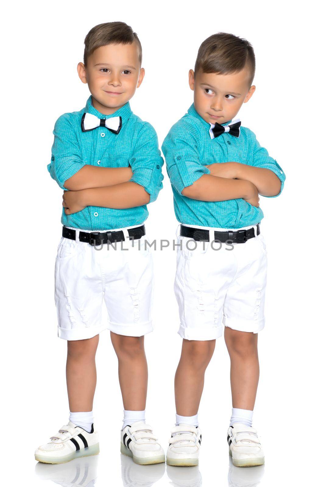 Two little brothers of Gemini together are sad. Isolated on white background