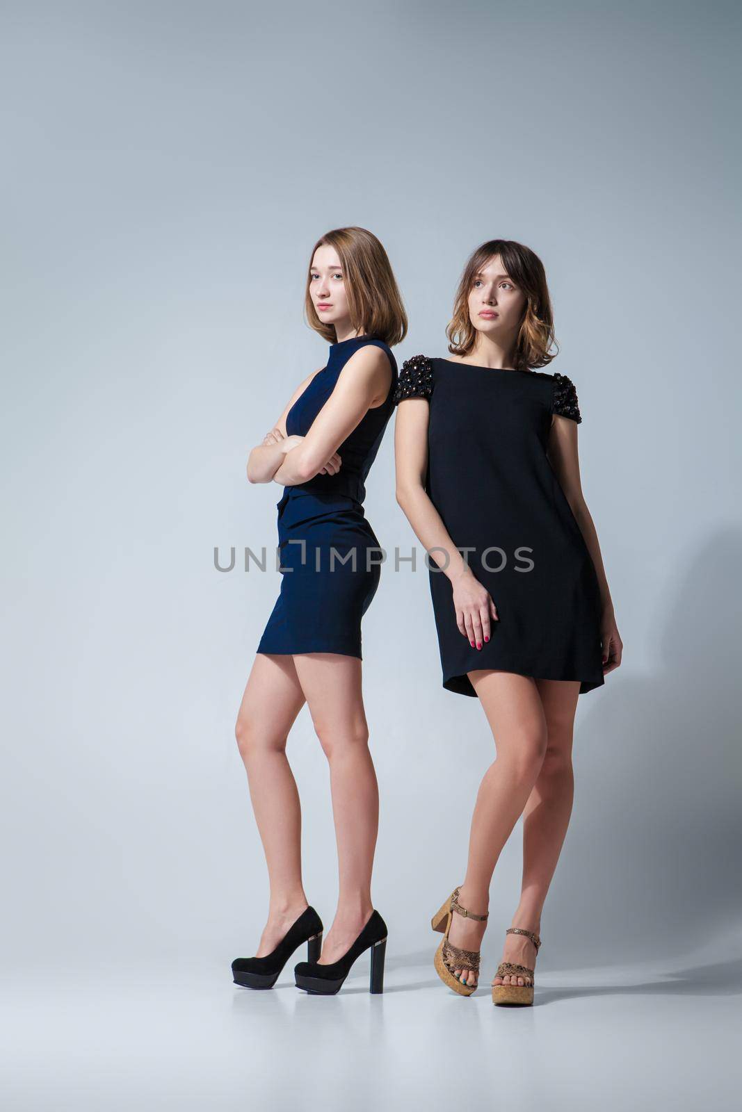 Two beautiful woman posing in dresses by Julenochek