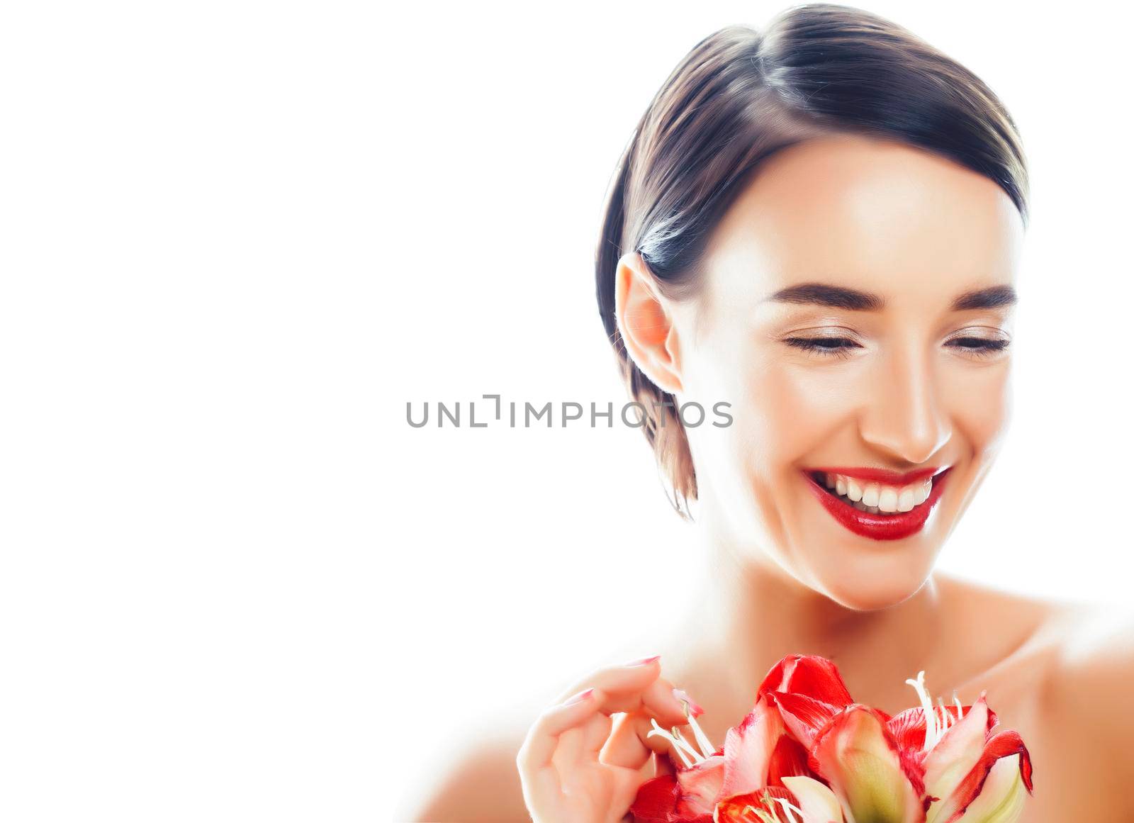 young pretty brunette real woman with red flower amaryllis isolated on white background