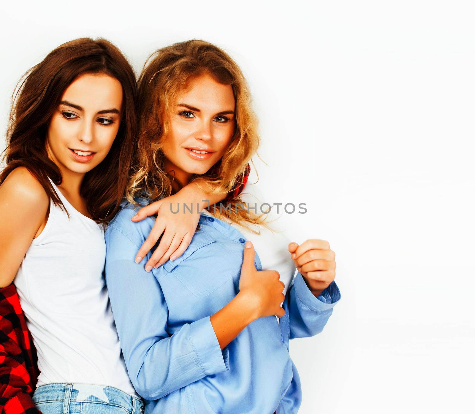 best friends teenage girls together having fun, posing emotional on white background, besties happy smiling, lifestyle real people concept close up. making selfie closeup