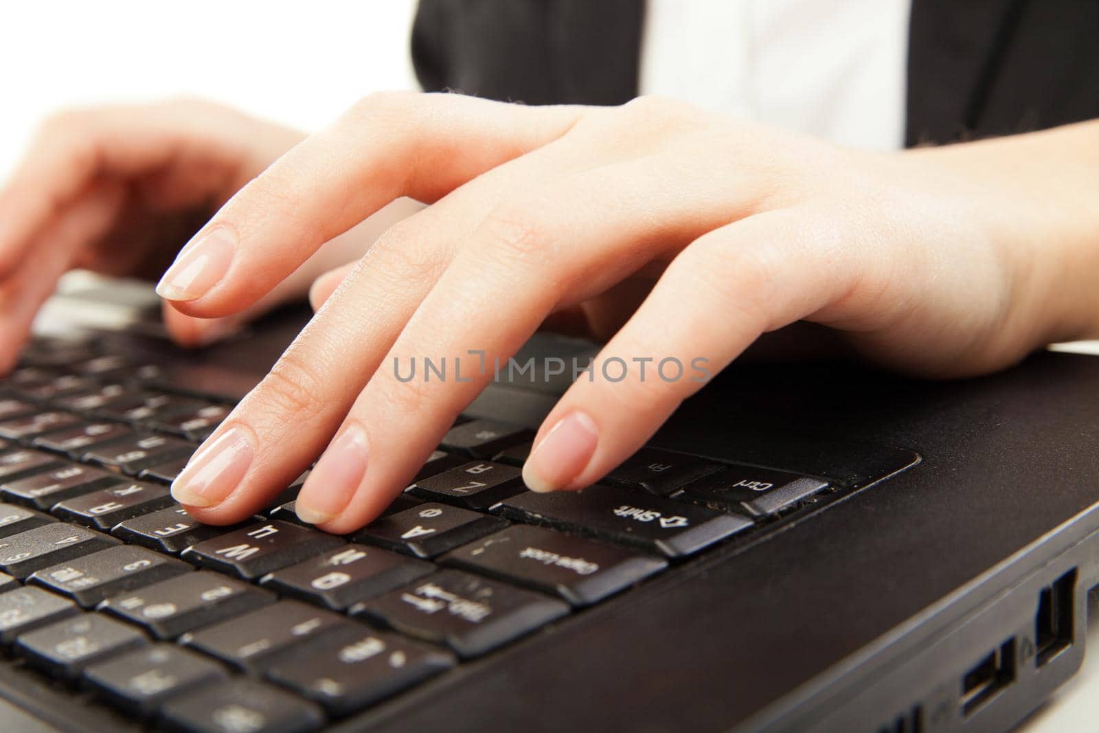 Woman hands typing on laptot, close-up, isolated by Julenochek