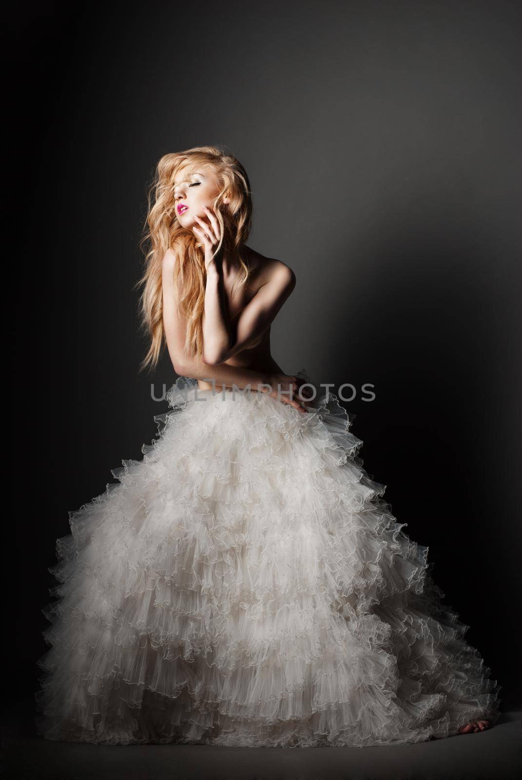 blond woman in a romantic pose with white skirt by Julenochek