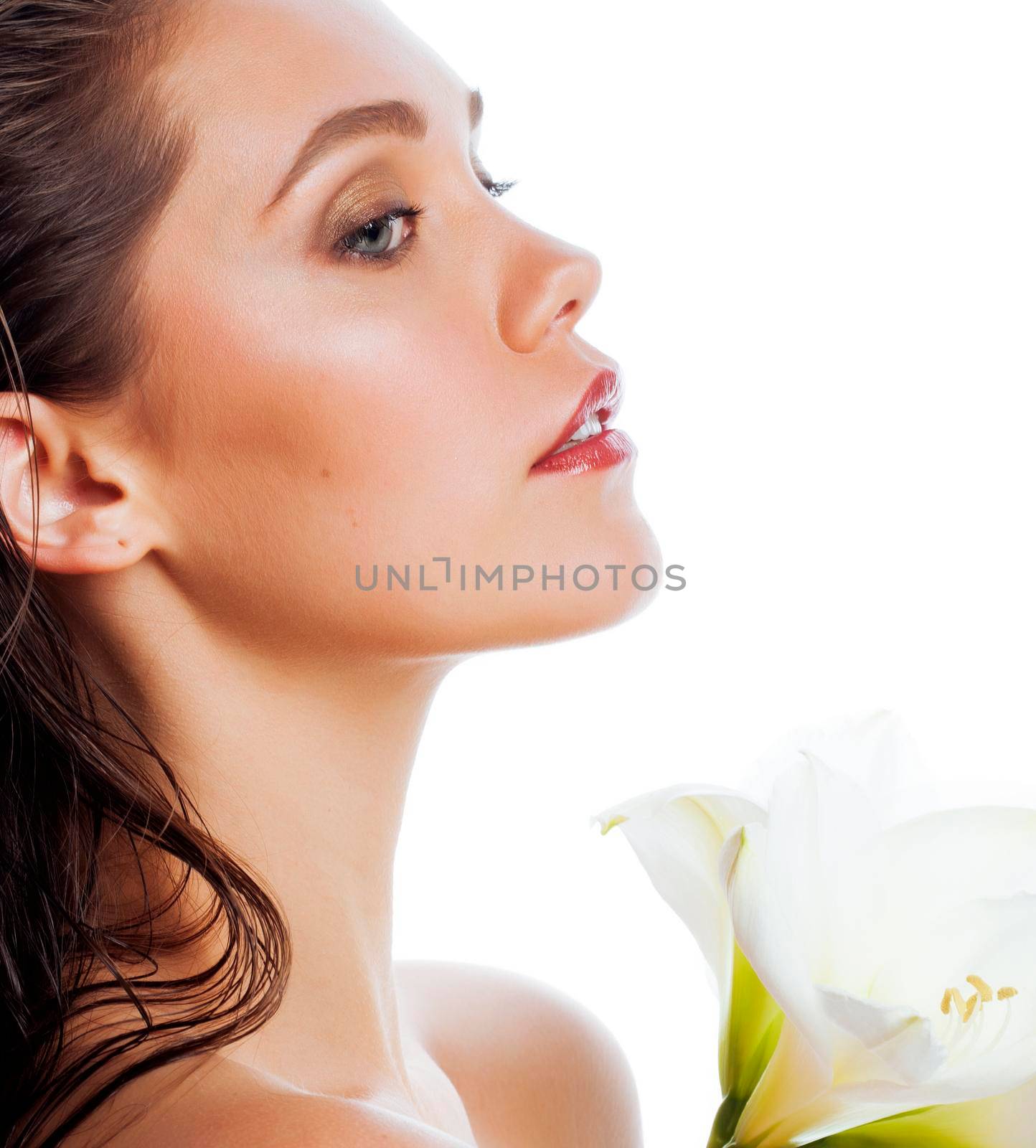 young pretty woman with Amarilis flower close up isolated on white, hands manicure