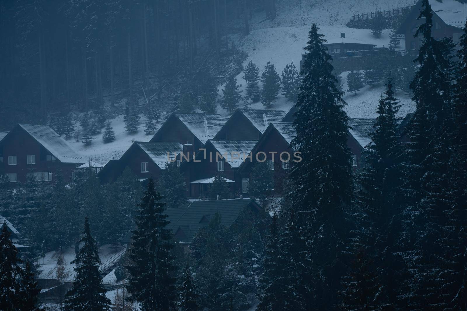 family with snowboards at winter resort