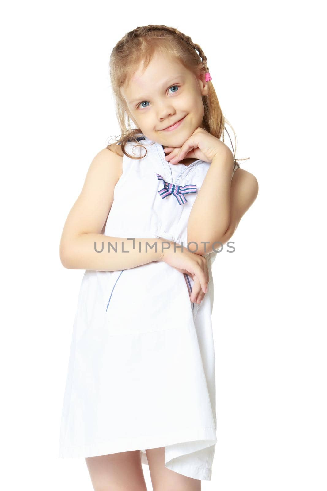 Studio portrait of a beautiful little girl. The concept of fashion, family happiness, harmonious development of the child. Isolated on white background.