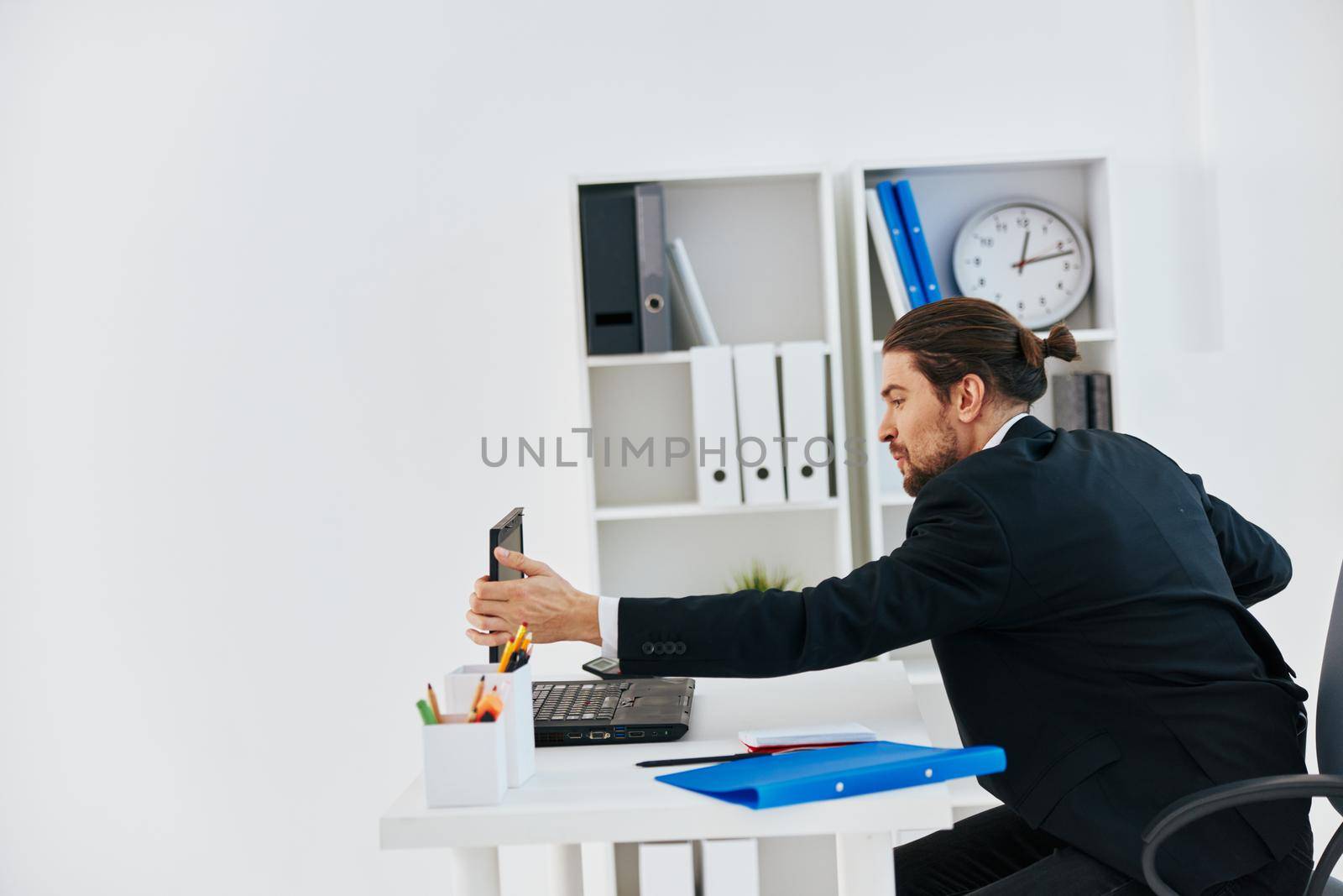 Man workflow in the office documents emotions technology. High quality photo
