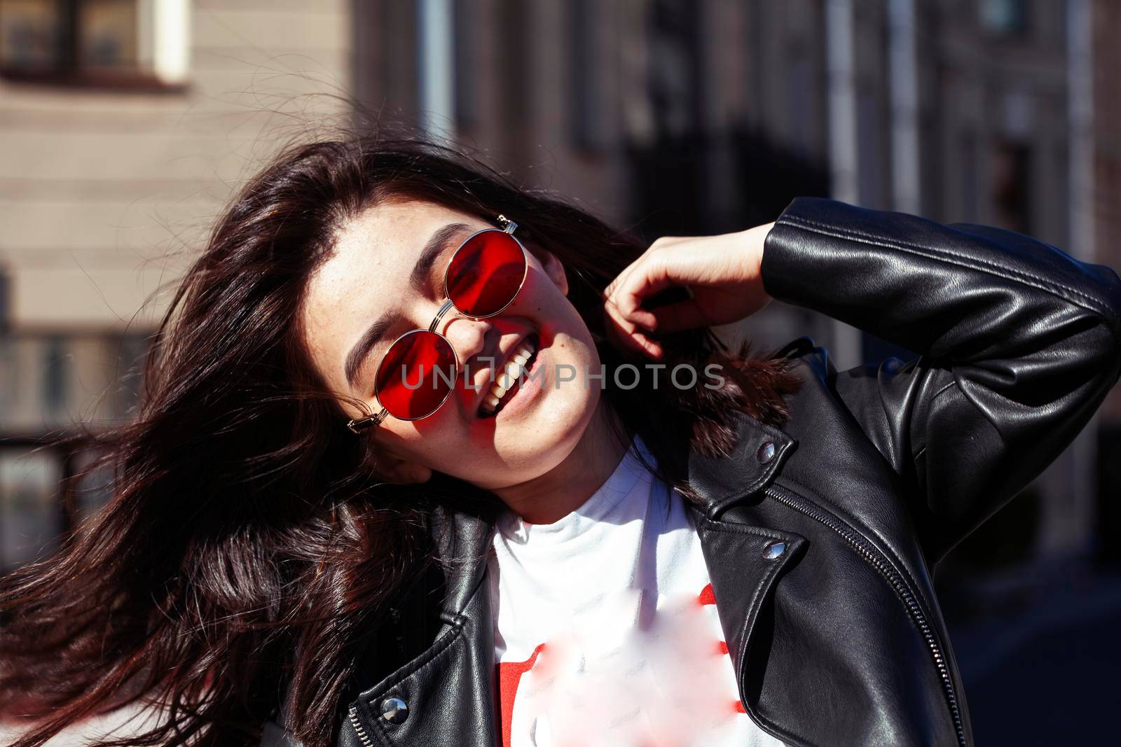 young pretty asian girl wearing sunglasses outside on big city street, lifestyle people concept close up
