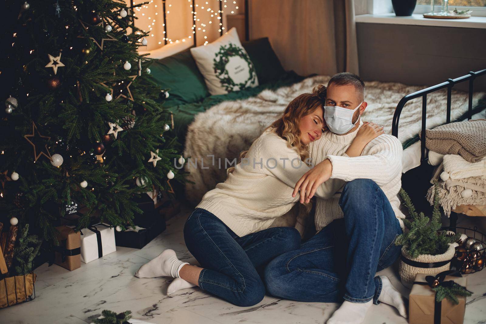 Woman hugging man in face mask. by StudioLucky