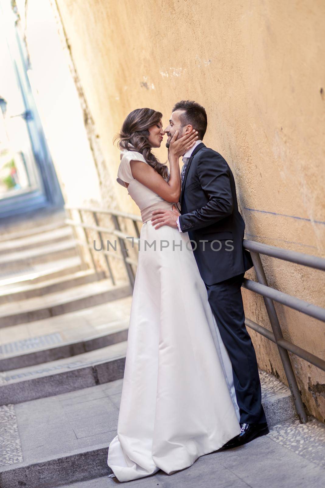 Just married couple in urban background by javiindy