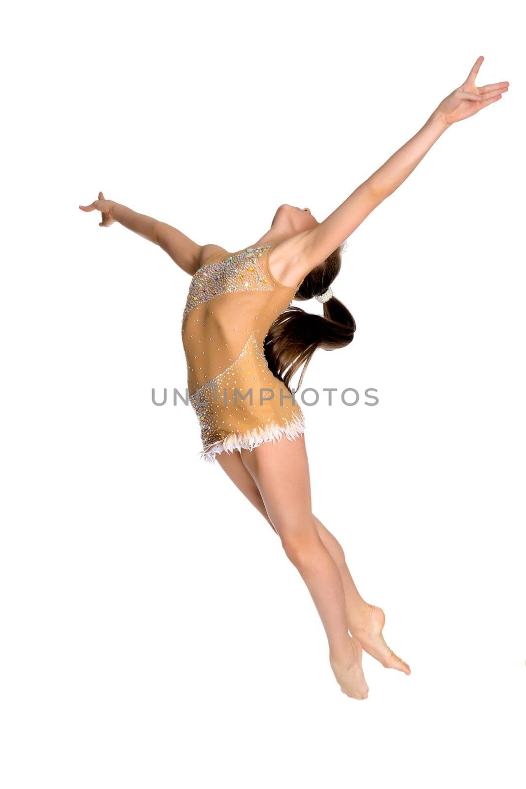 Girl gymnast performs a jump. The concept of fitness, gymnastics, sports. Isolated on white background.