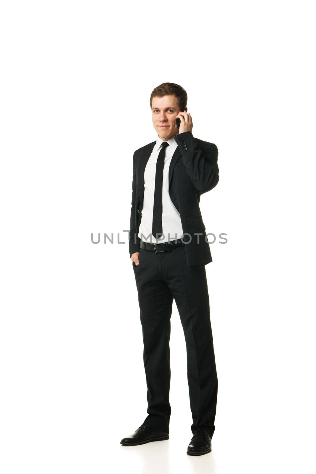 Close up of a laughing businessman on the phone isolated on white background