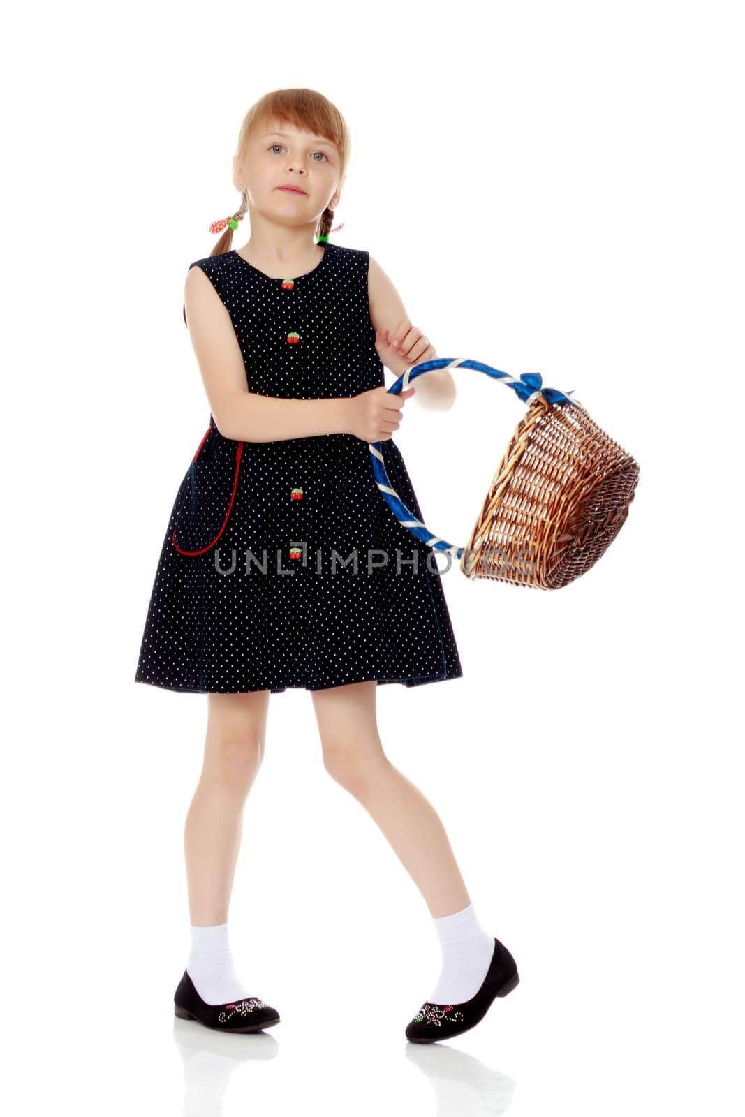 A little girl with a wicker basket made of willow twigs. The concept of family rest, harvesting, picking mushrooms and berries. Isolated over white background