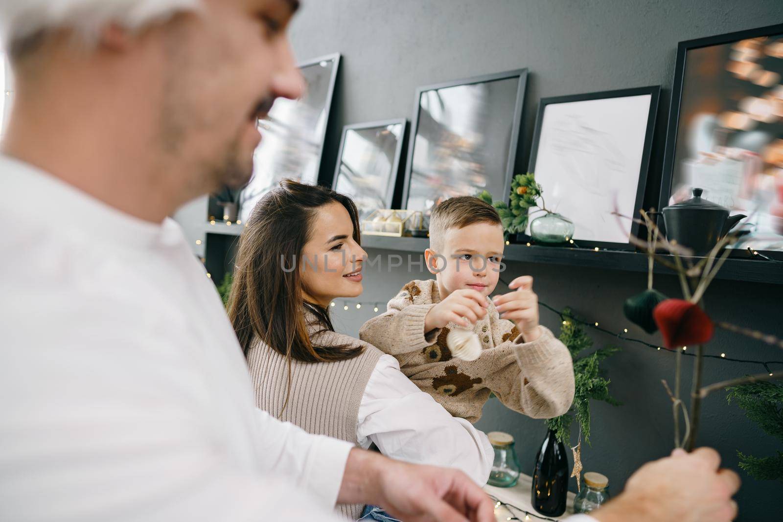 Happy family making Christmas decorations at home together, portrait