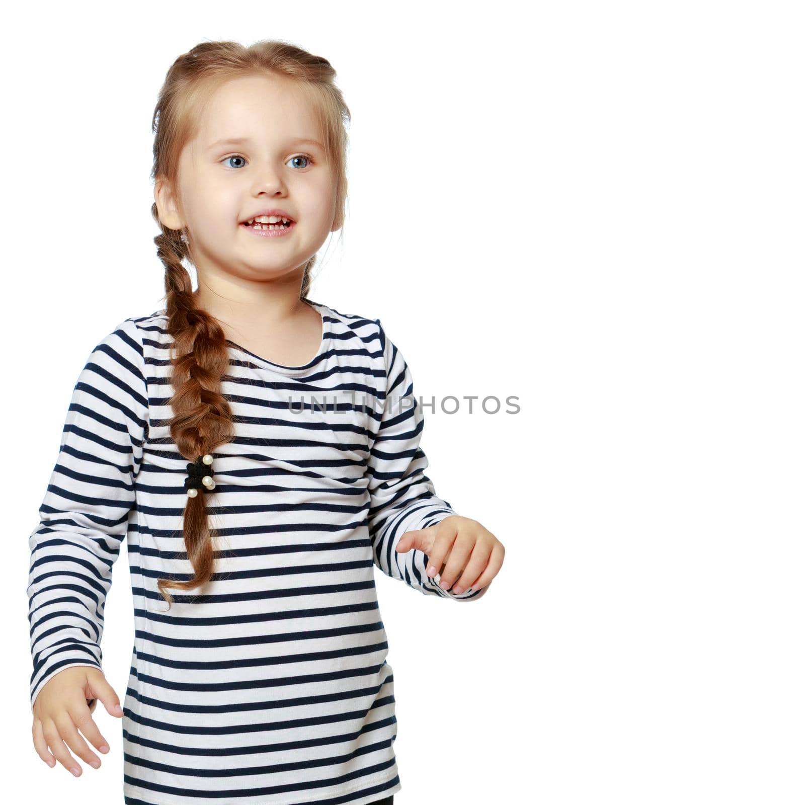 Studio portrait of a beautiful little girl. The concept of fashion, family happiness, harmonious development of the child. Isolated on white background.