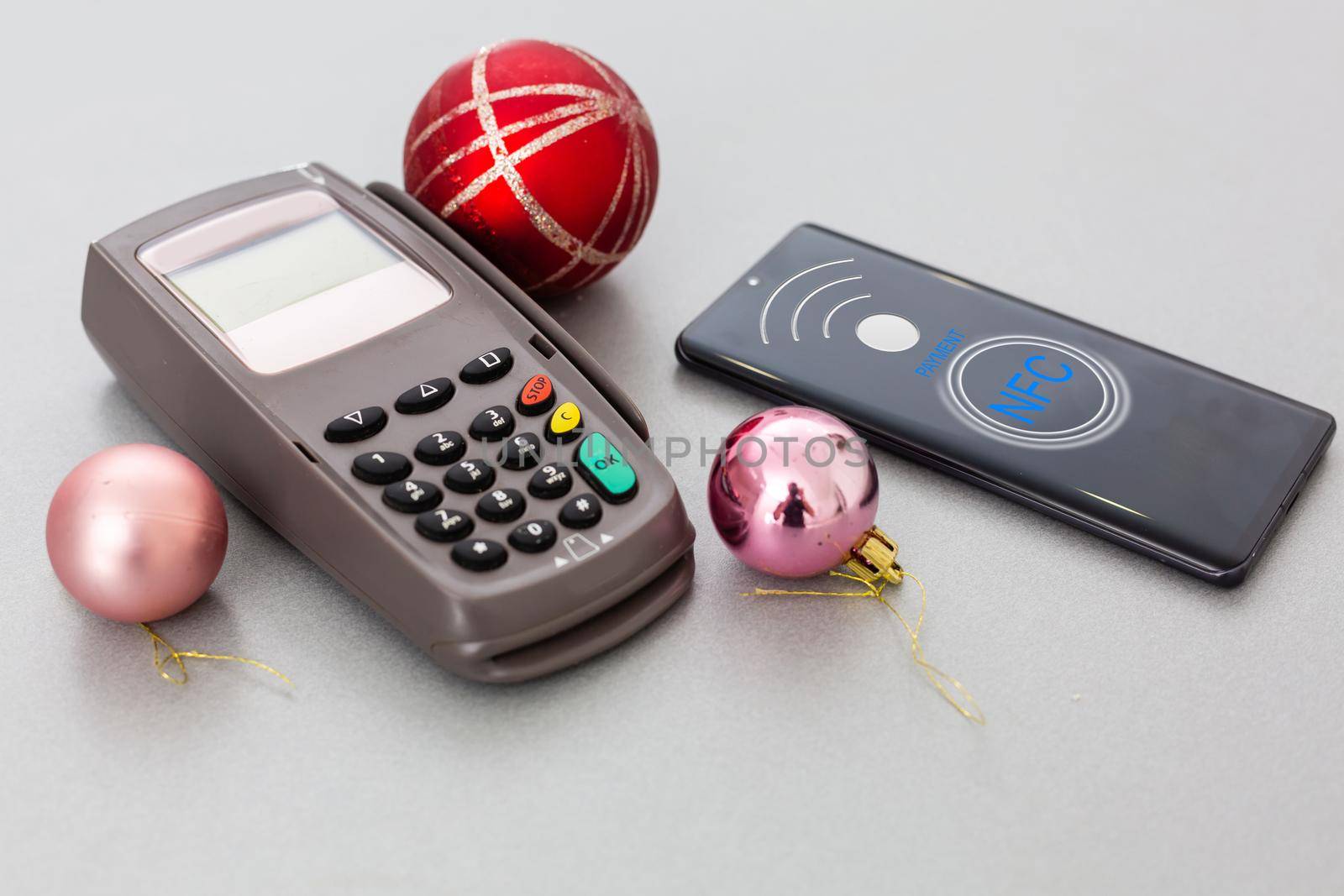 Customer using mobile phone to pay by NFC