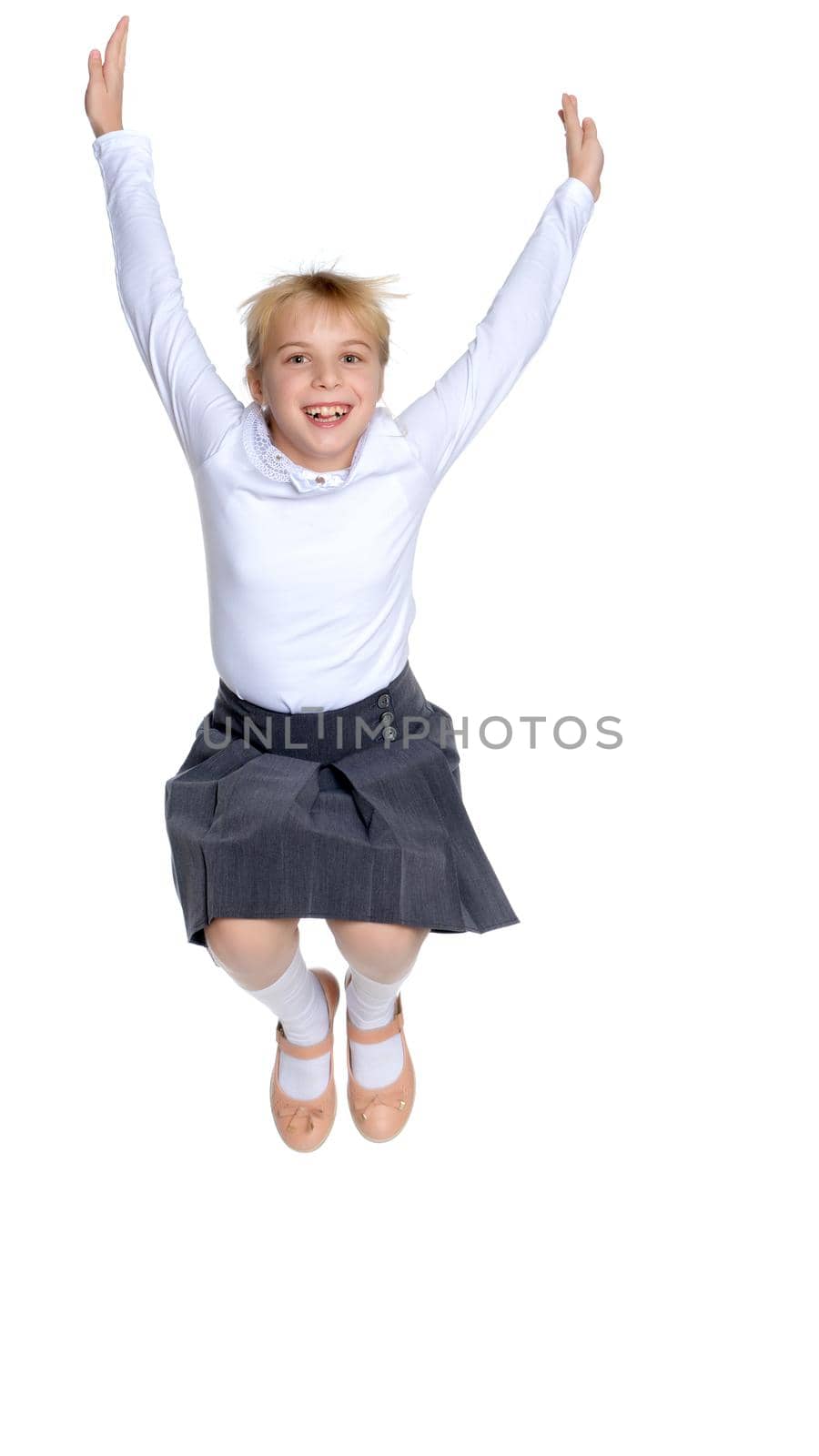 A little girl is jumping and waving her hands. The concept of a happy childhood, outdoor recreation. Isolated on white background.
