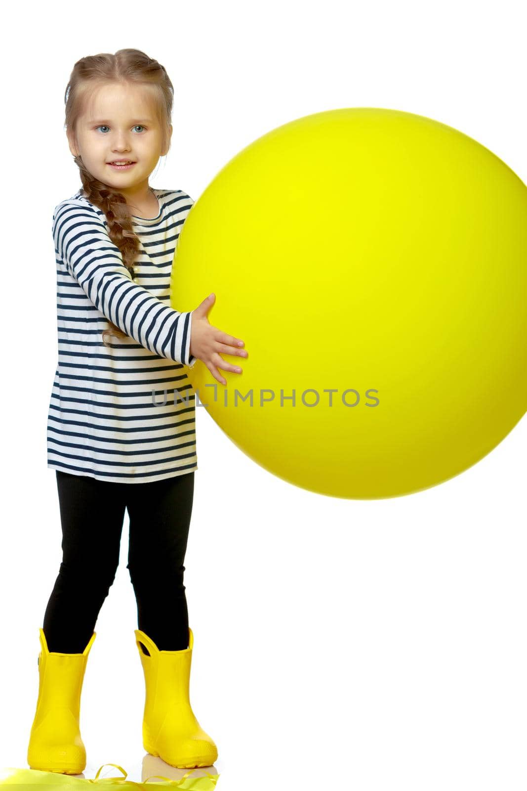 Little girl is playing with a balloon. The concept of a holiday, a birthday, a holiday in the fresh air. Isolated on white horse