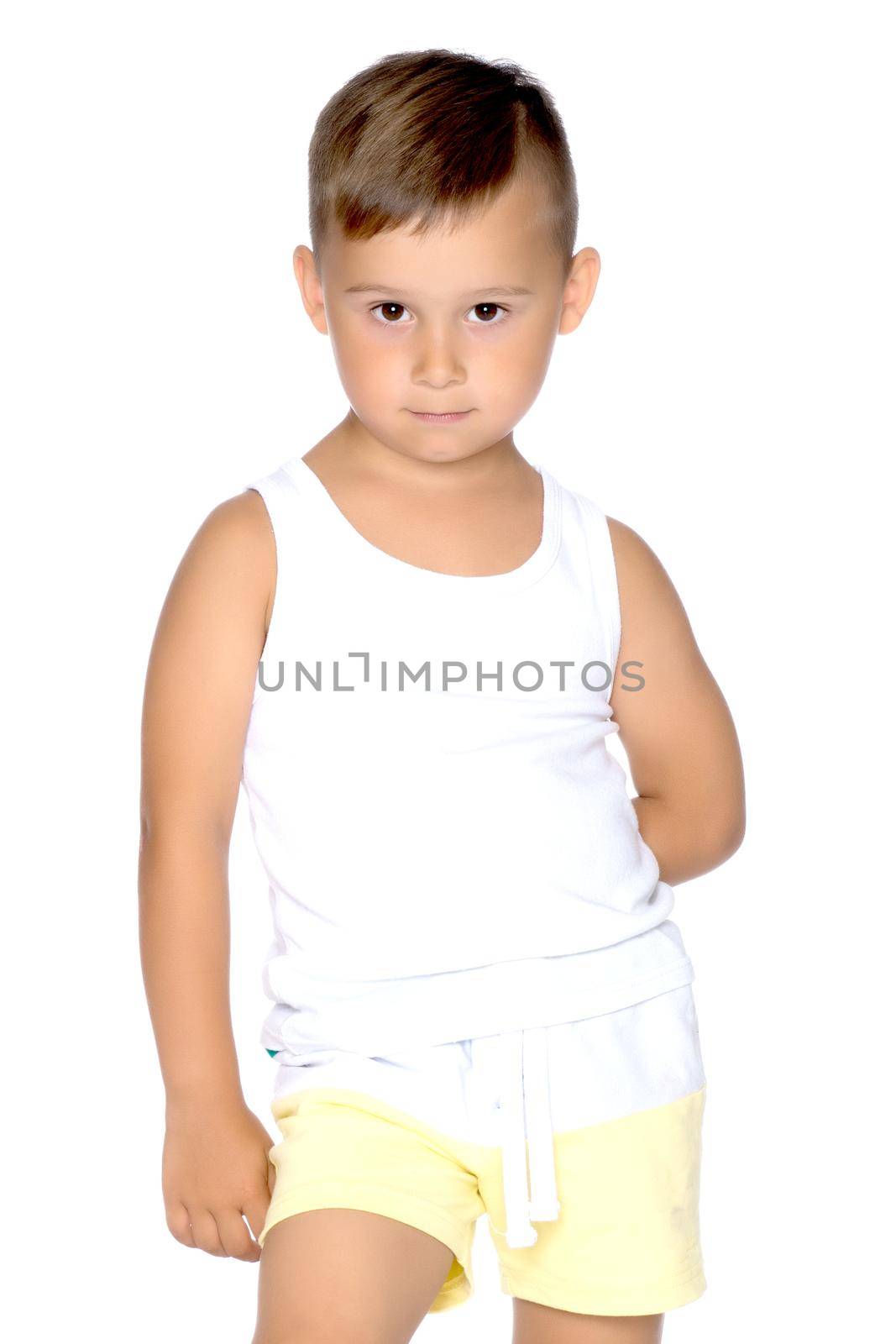 A little boy in a white T-shirt. by kolesnikov_studio