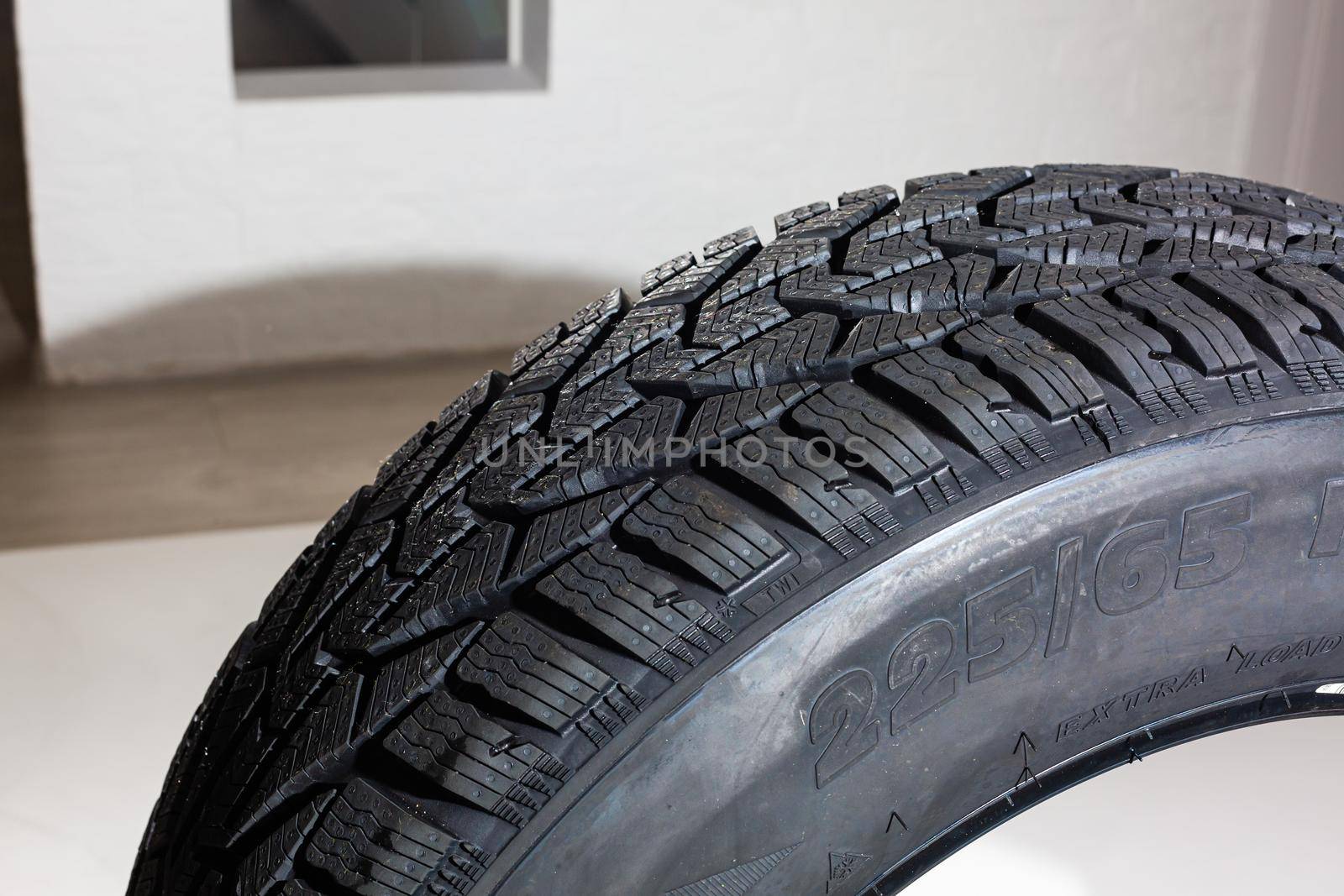 winter tire on gray background