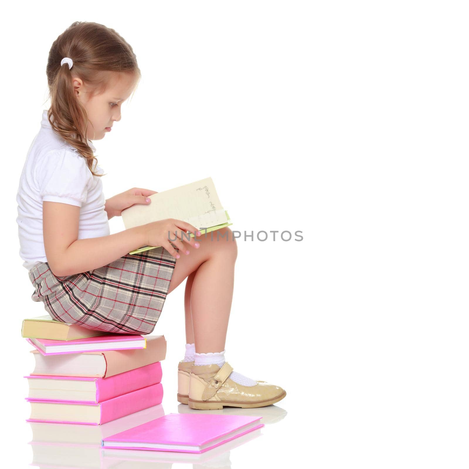 Little girl with a book by kolesnikov_studio