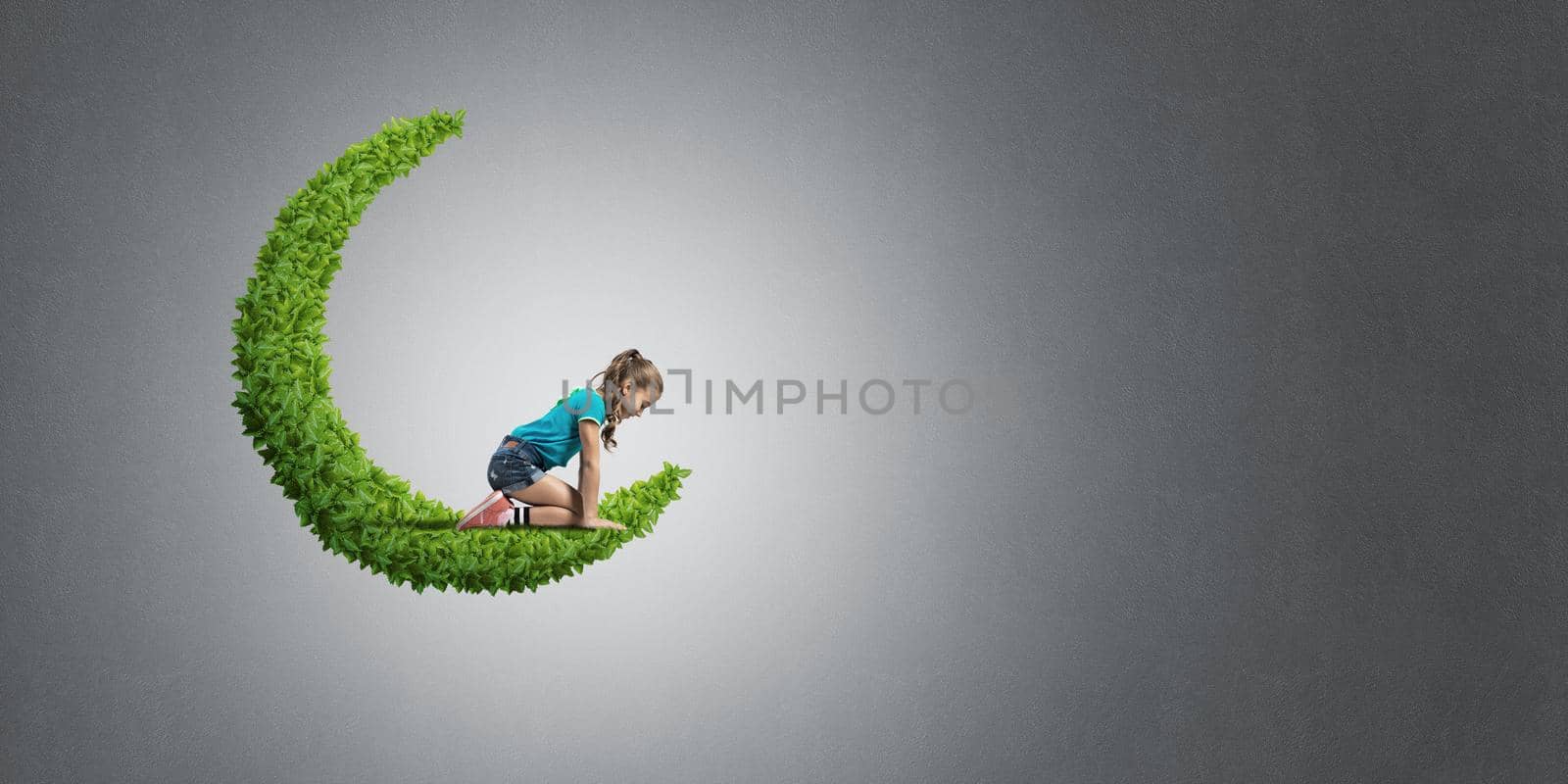 Concept of careless happy childhood with girl on green moon by adam121