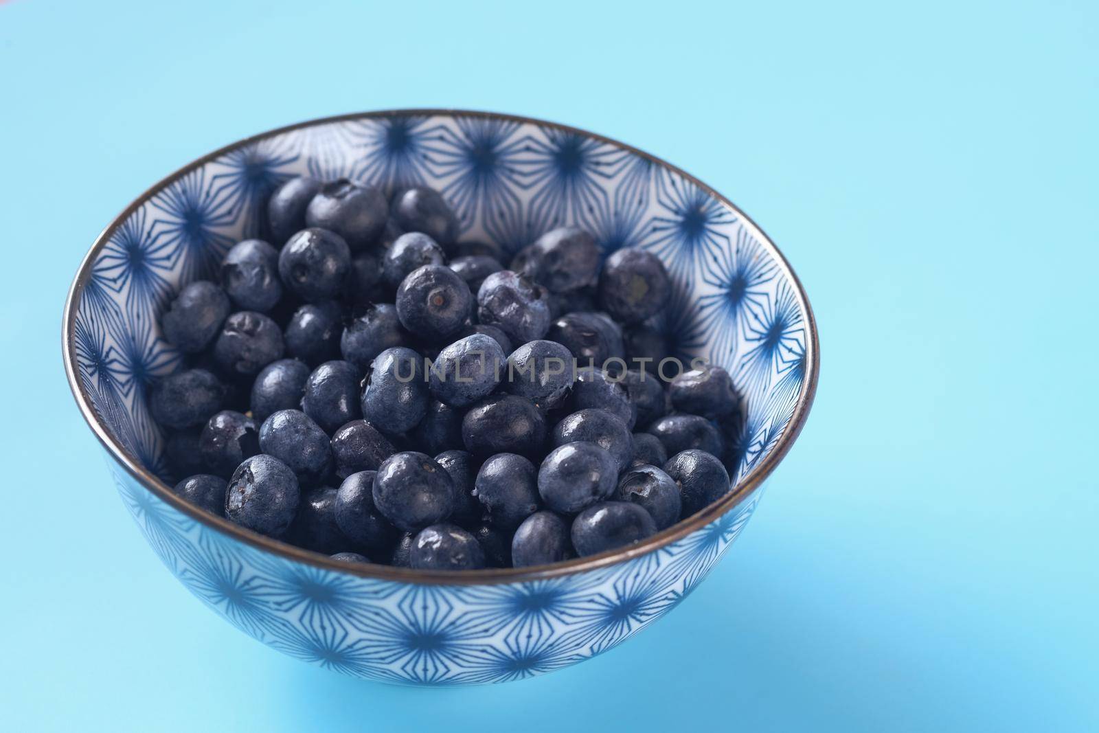 Close up of fresh blue berry with water drops