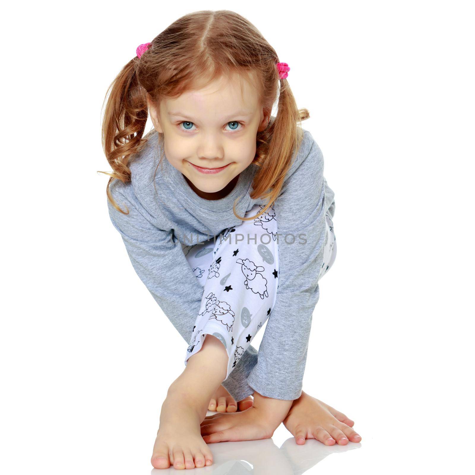 Little girl in pajamas. The concept of family happiness, child, childhood, relaxation. Isolated on white background.